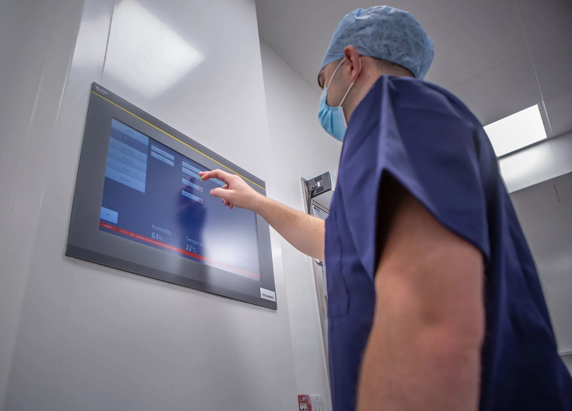 Surgeon Using Surgeon's Panel in ModuleCo Modular Operating Theatre Suite Image