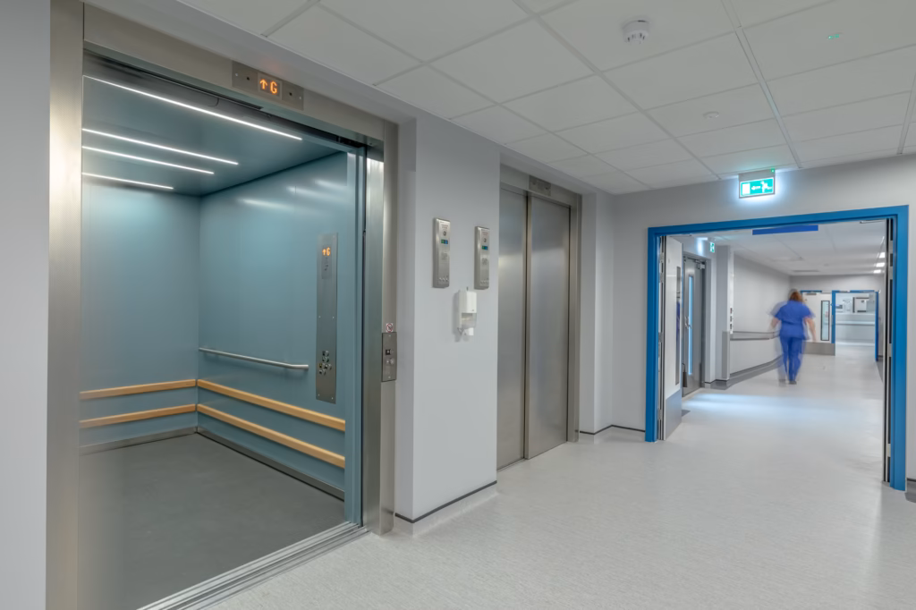 Hospital corridor showing bed lifts within the modular multi‑storey ward at Royal Shrewsbury Hospital